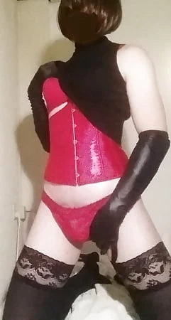 sexy sissy posing in corset        