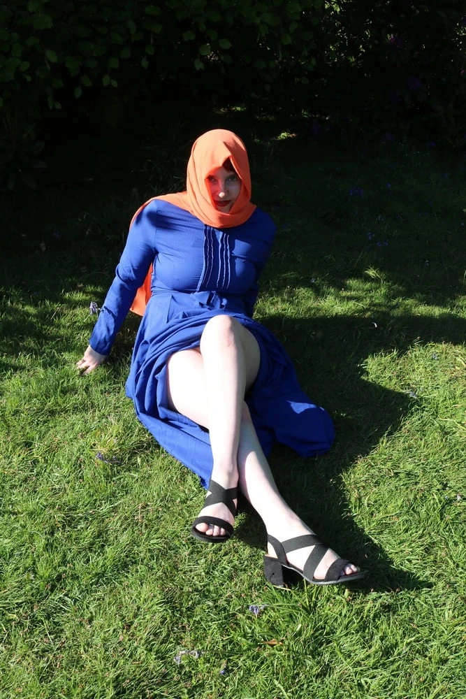 hijab and abaya flashing outdoors #46