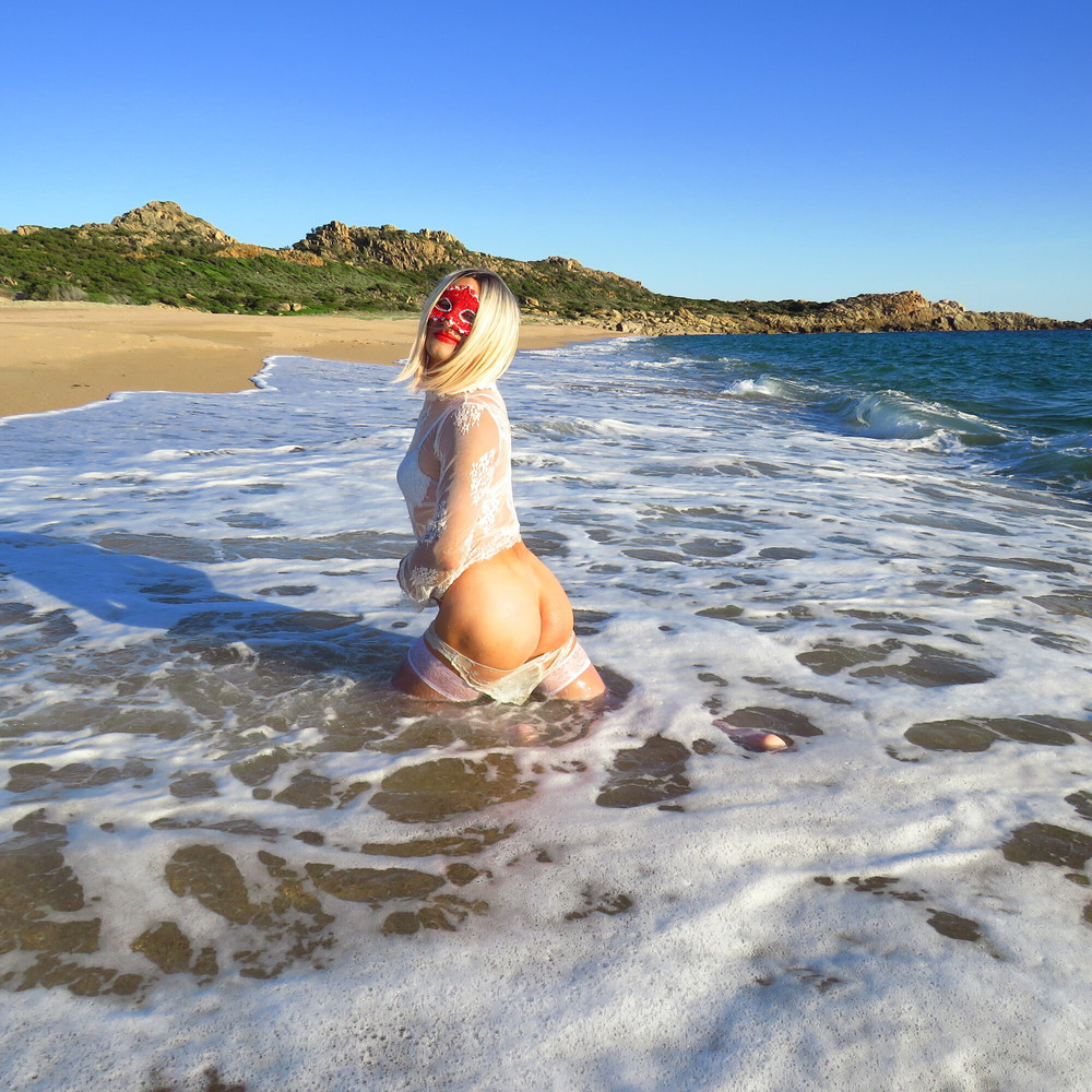 Sexy MILF Blonde shows off her ass on the beach. #22