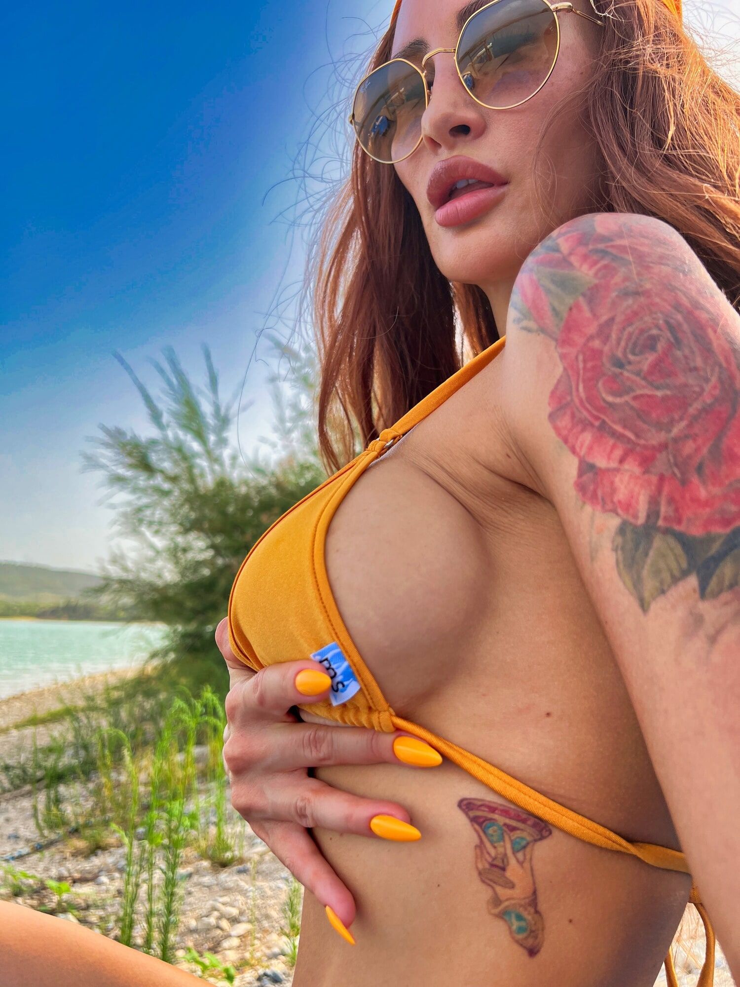 Big boobs tattoed MILF xAmbretta tans in micro bikini #8