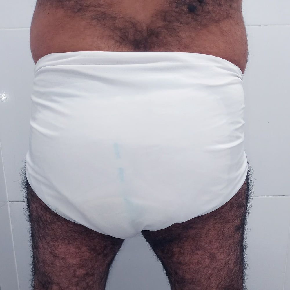 SHOWING WHITE DIAPER IN WORK BATHROOM. #11