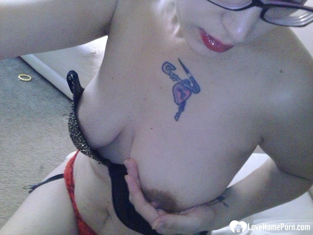 Nerdy girl sensually fingers her wet snatch