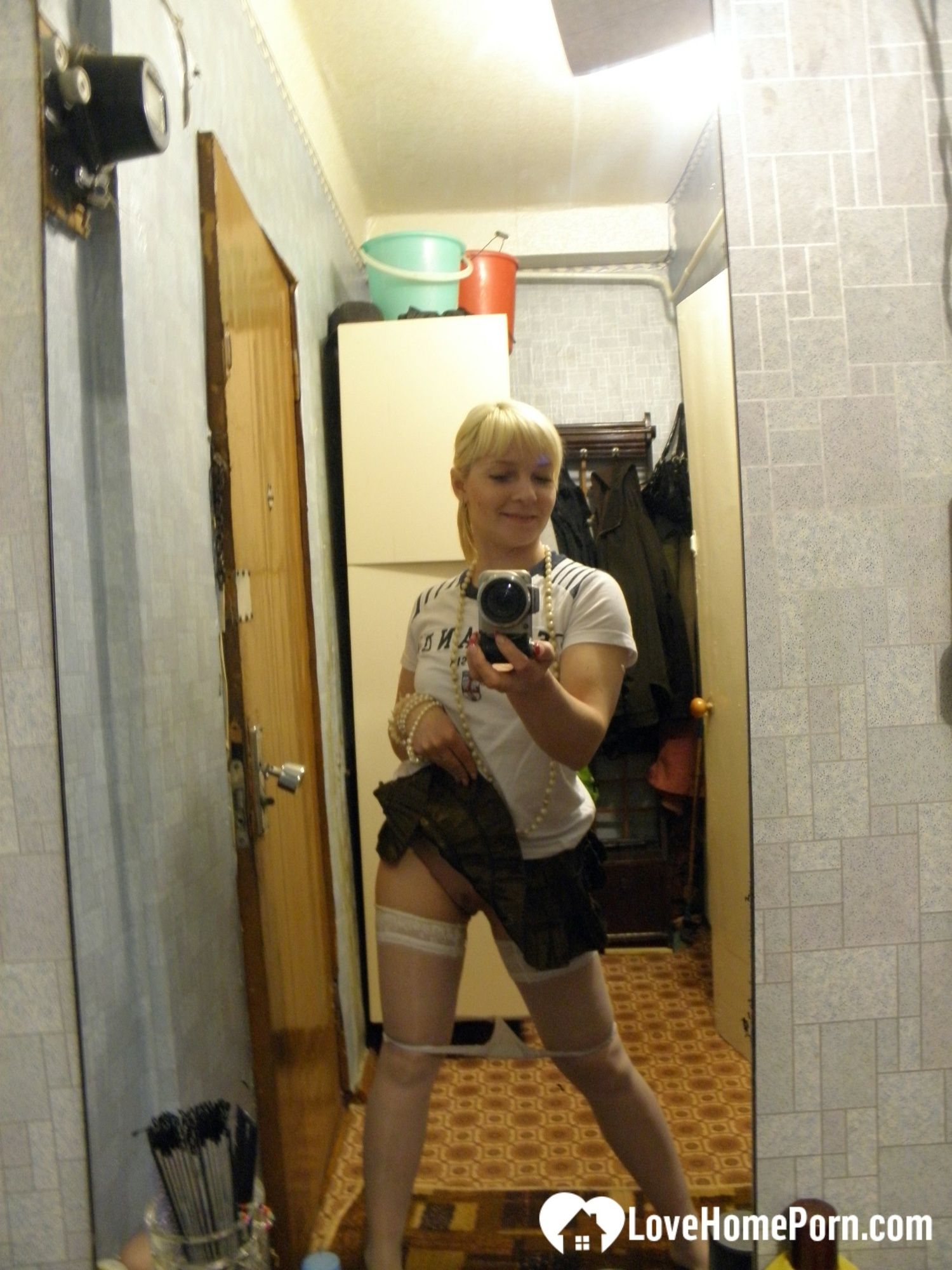 Aroused blonde in stockings taking naughty selfies #13
