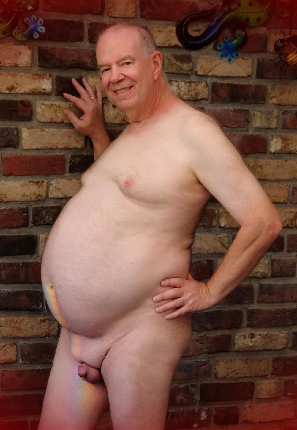 Fat Daddy Nick poses casually from a wall #3