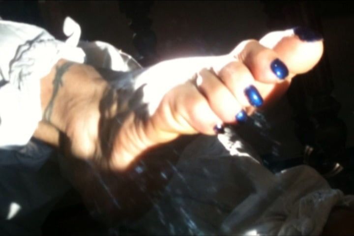 Blue toenails under sun ray #12