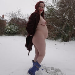 Pregnant flashing naked in the cold snow