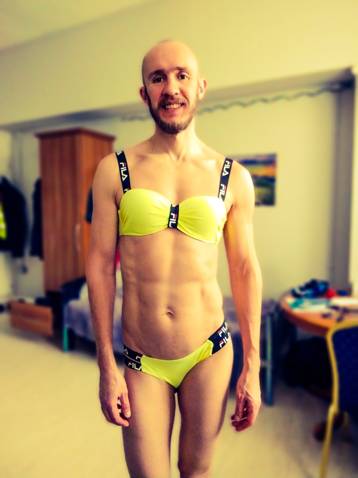Bearded athletic man posing in yellow swimsuit  #6