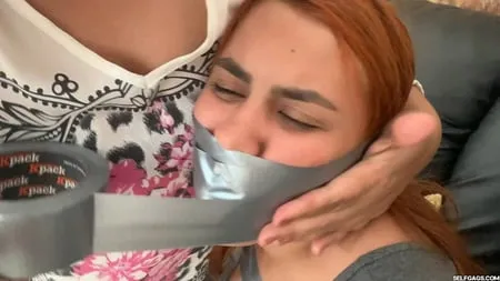 hogtaped student lectured with foot whipping in tape bondage         