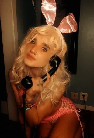 pink bunny talking on the phone while showing off pussy         