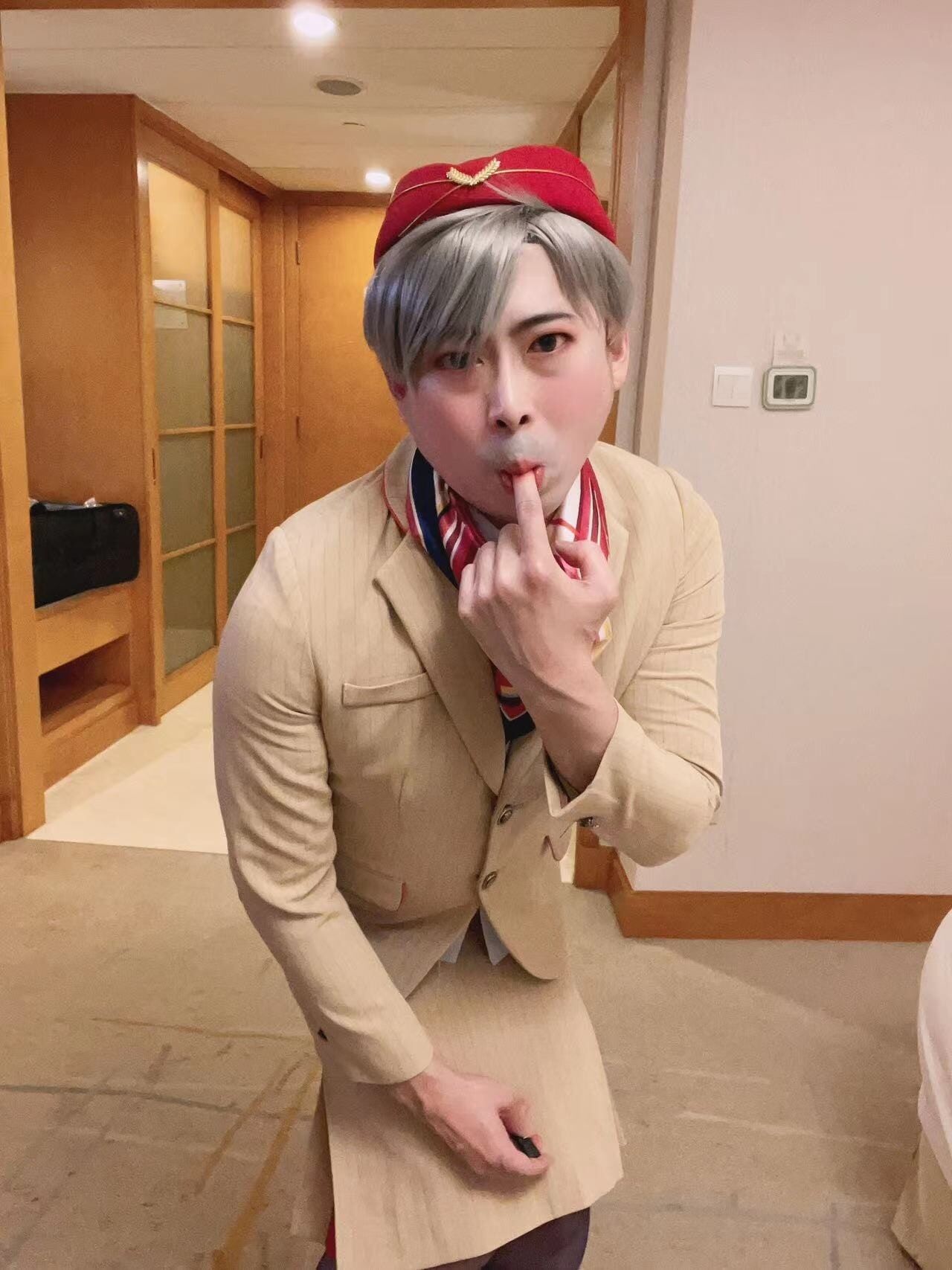 Asian femboy sissy in Emirates flight attendant dress