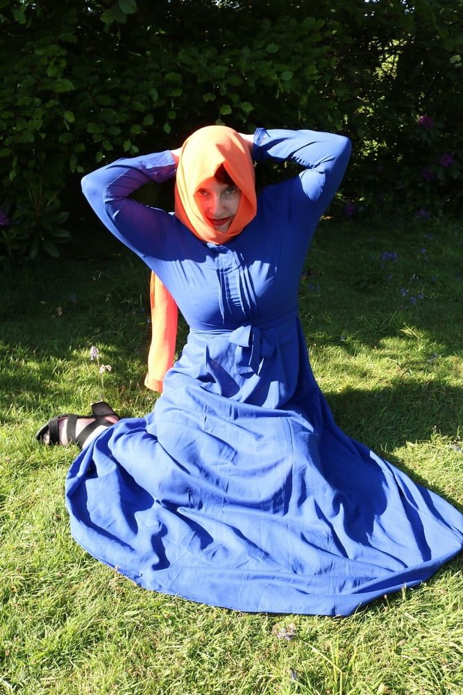 hijab and abaya flashing outdoors #11