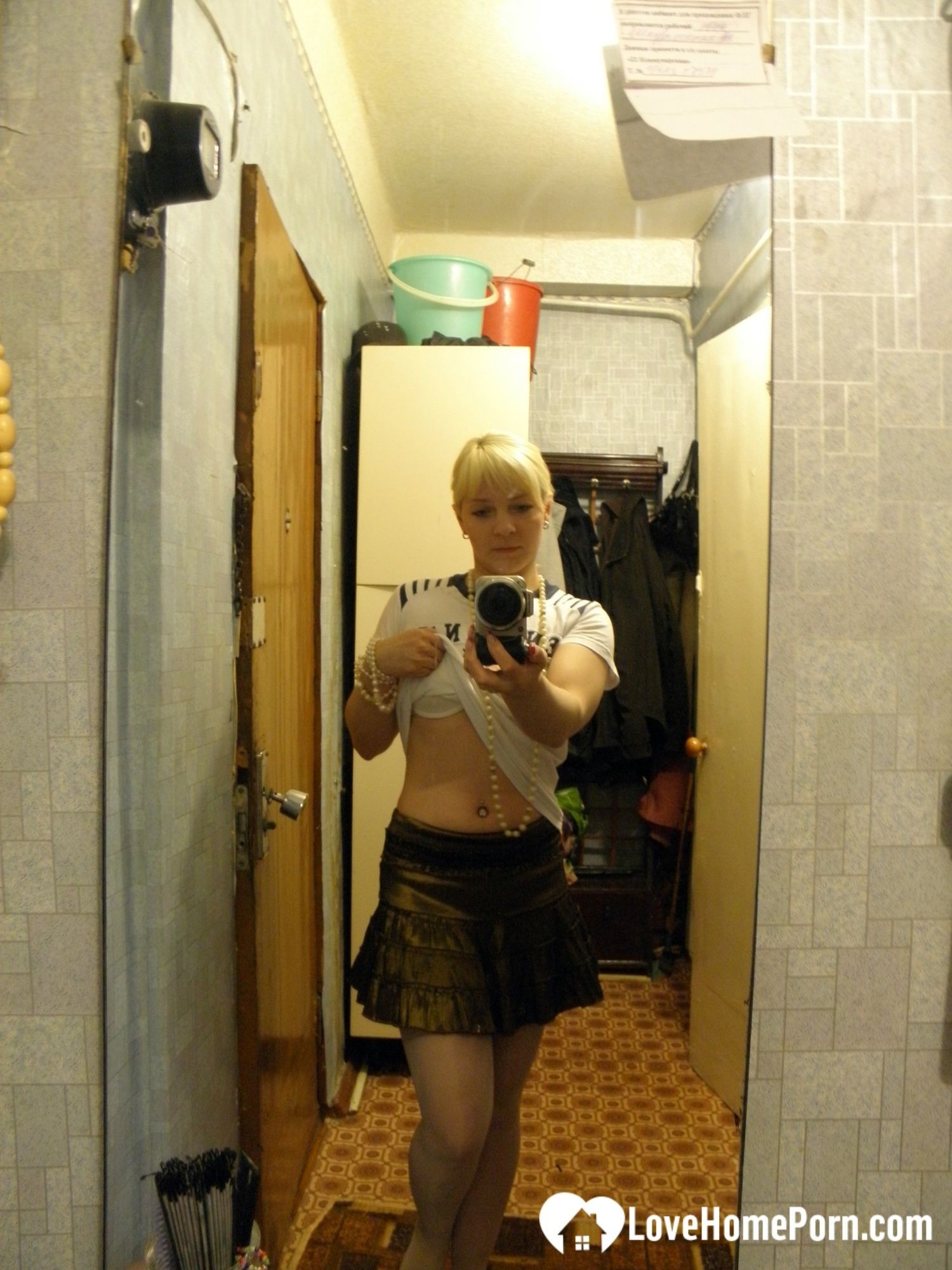Aroused blonde in stockings taking naughty selfies #4