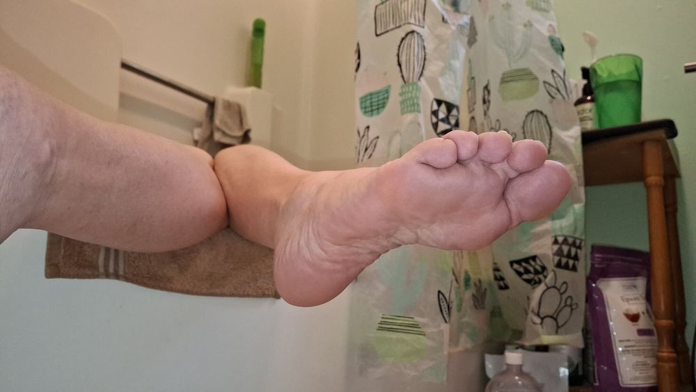 Showing off her soles and toes in the bath #19