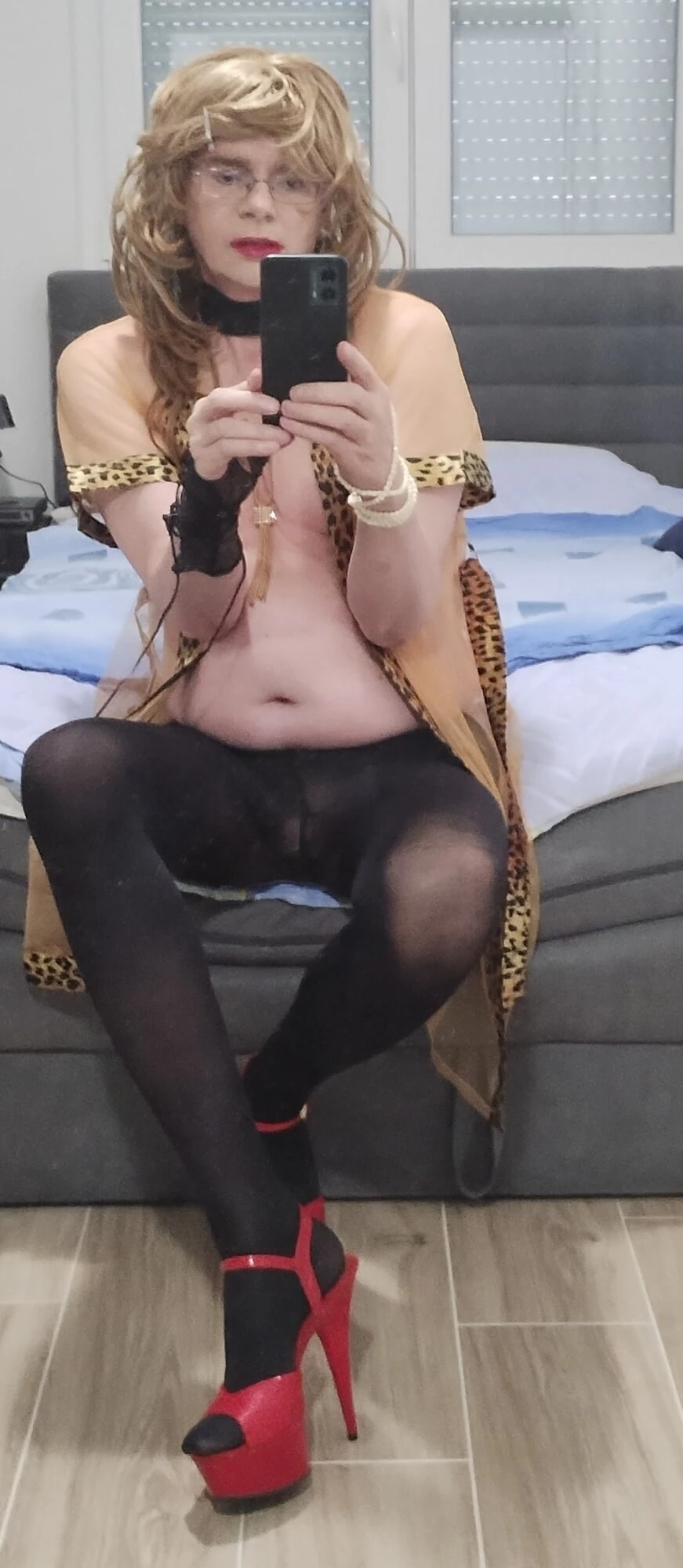 Tranny MILF sits half naked in her new stylish lingerie