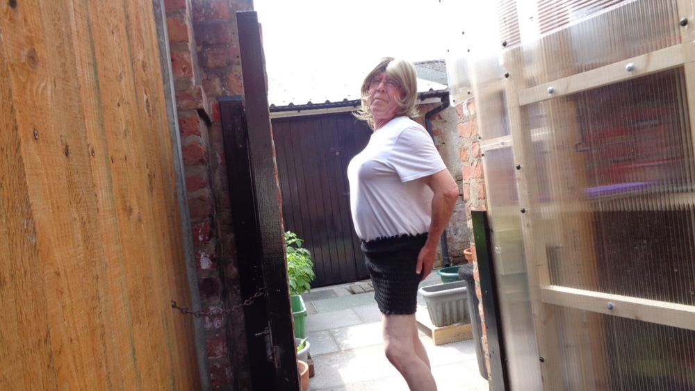 Crossdresser Joanne in the garden.