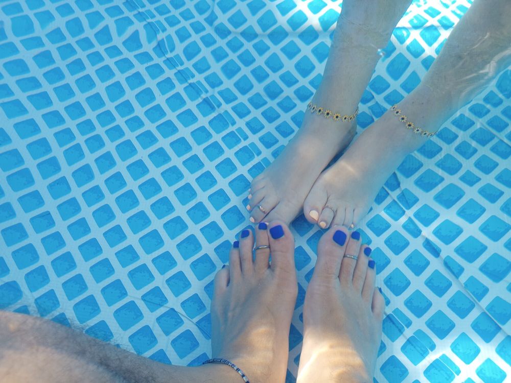 Showing off our pedicures in the pool #17