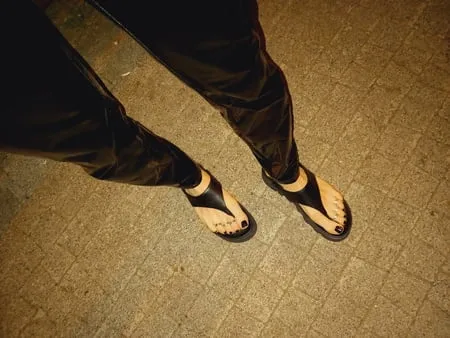 platform flip flops and latex pants         