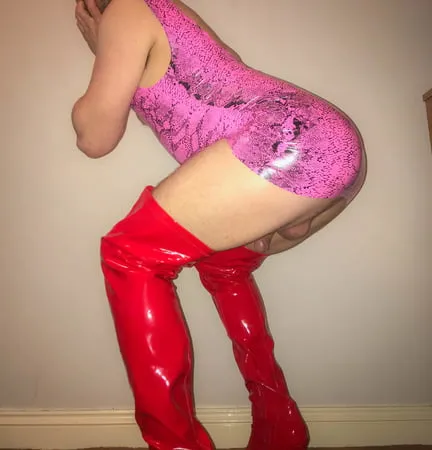 pink vinyl pvc snakeskin dress with red latex boots         