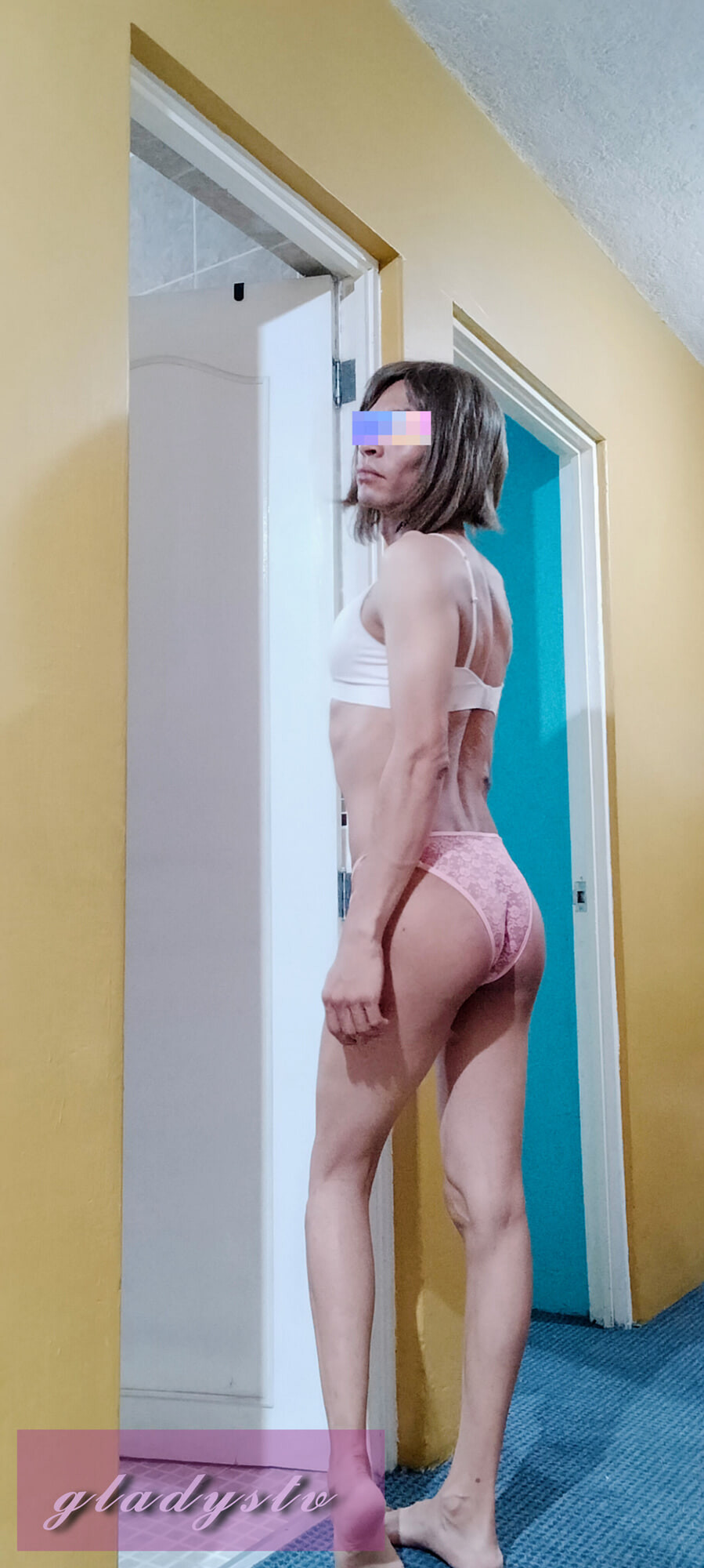 Transvestite with high heels and stockings