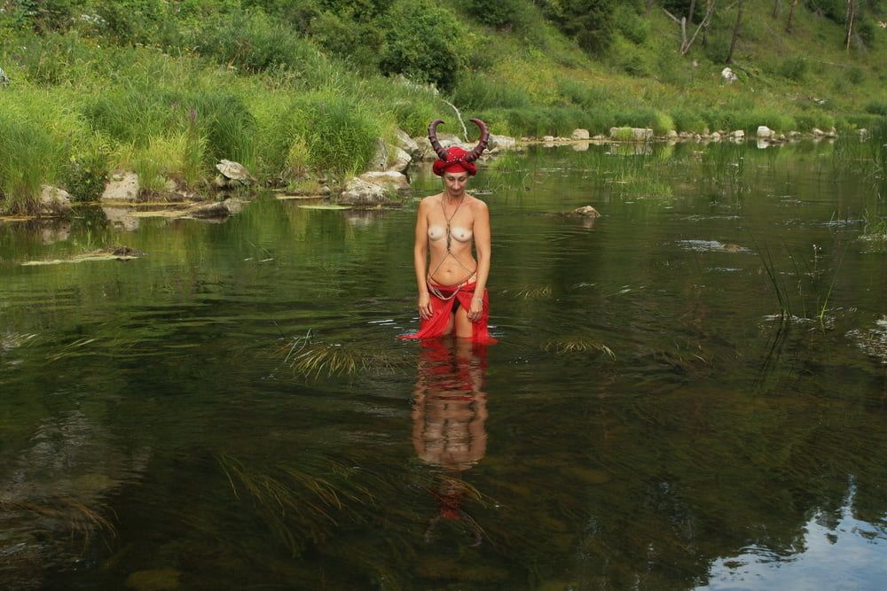 With Horns In Red Dress In Shallow River #59