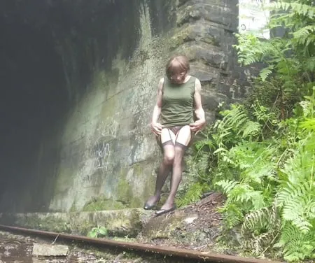 road trip to old train tunnel green dress         