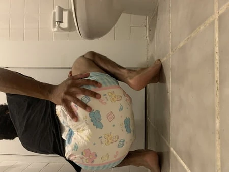 Black boy in wet diaper