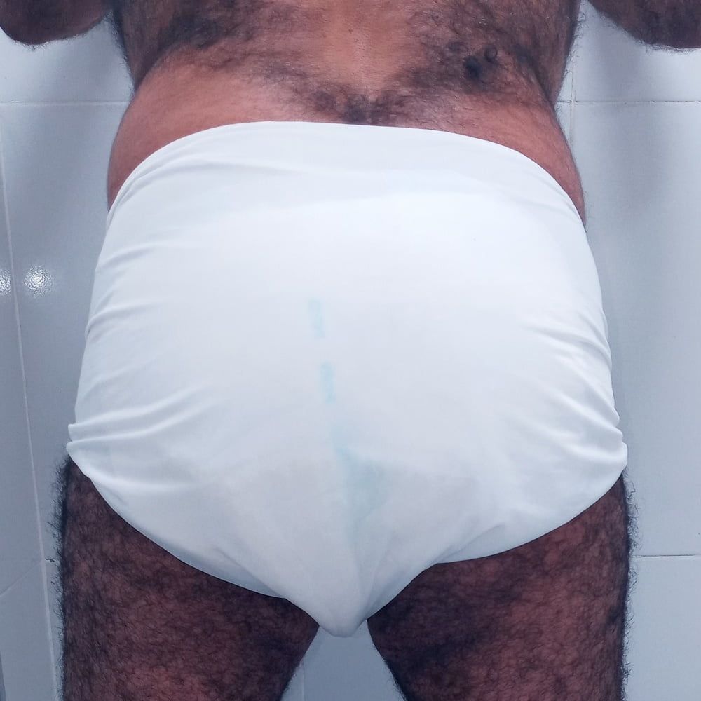 SHOWING WHITE DIAPER IN WORK BATHROOM. #13