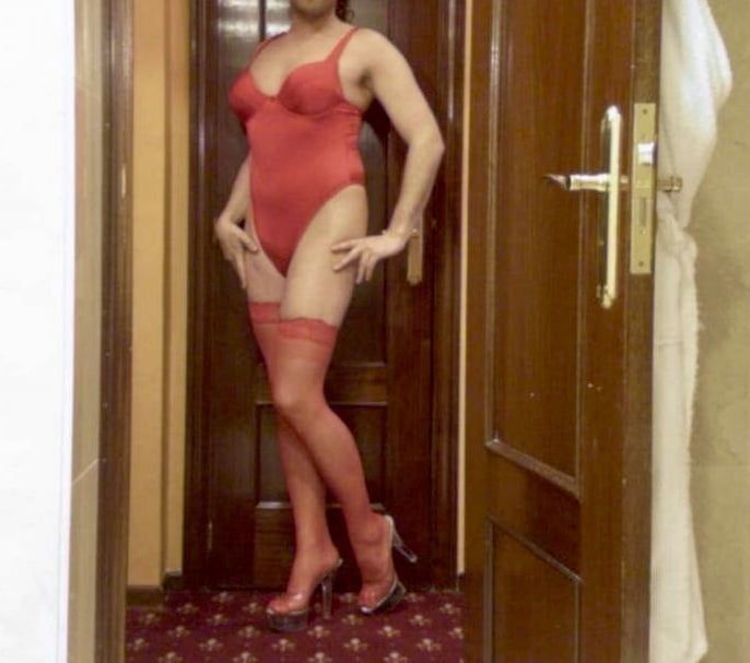 Wetting myself in my red body and stockings oops!