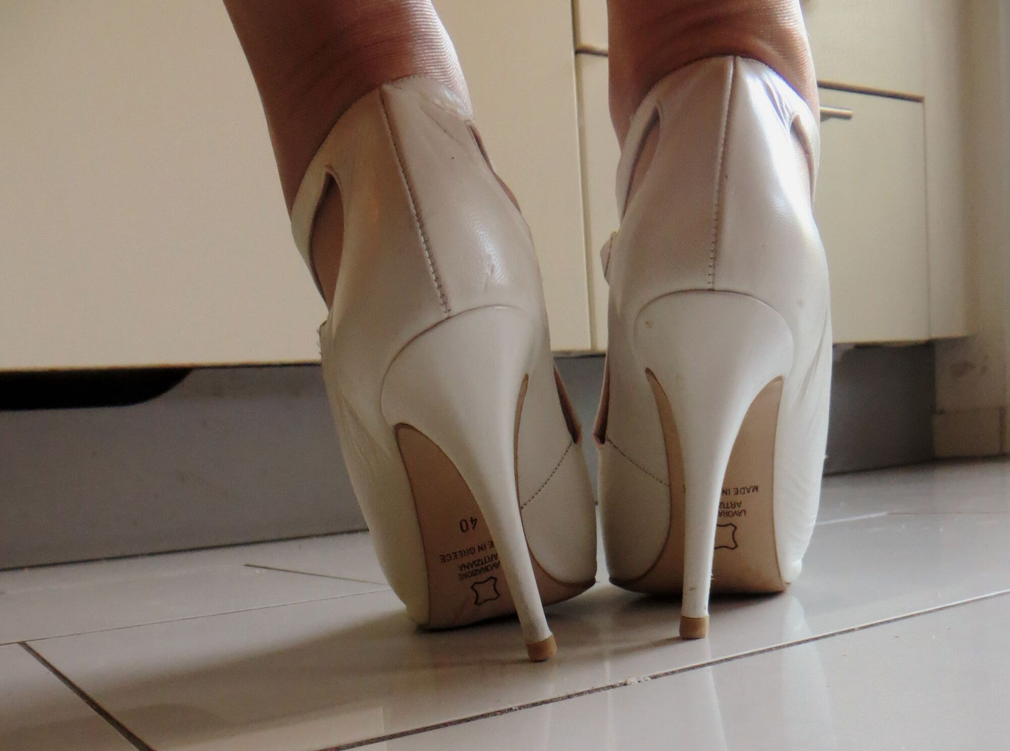 white greec high heel sandals with tan nylon stockings