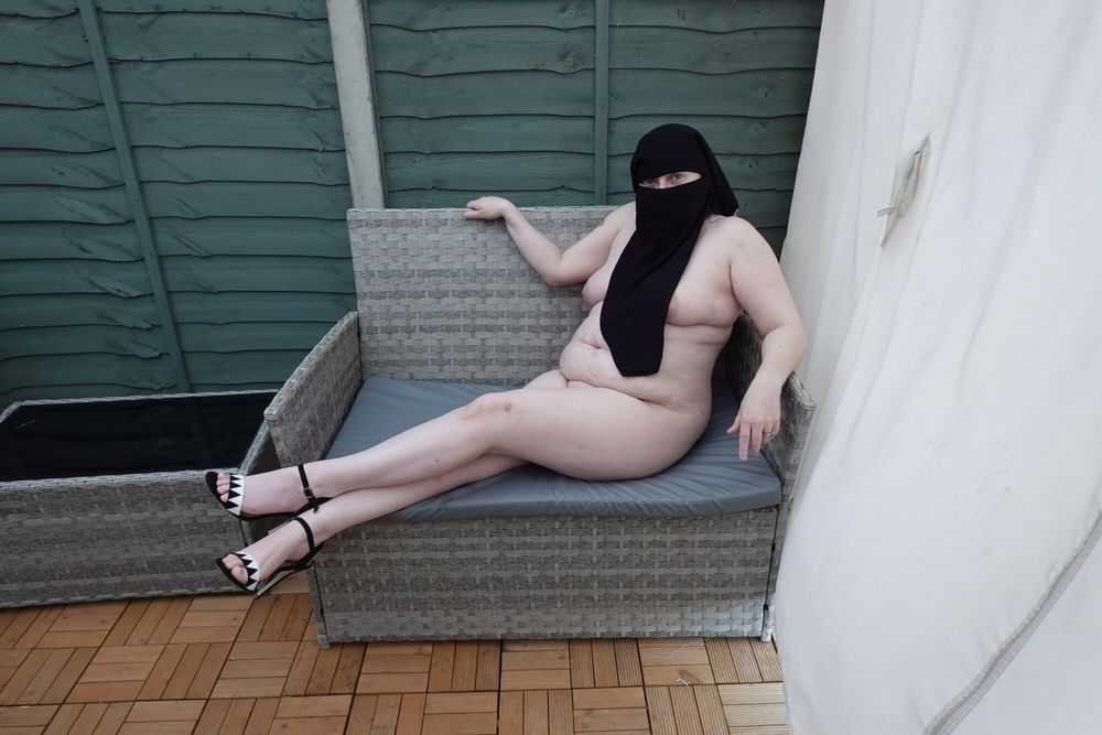 Shy wife in Niqab high heels in the yard