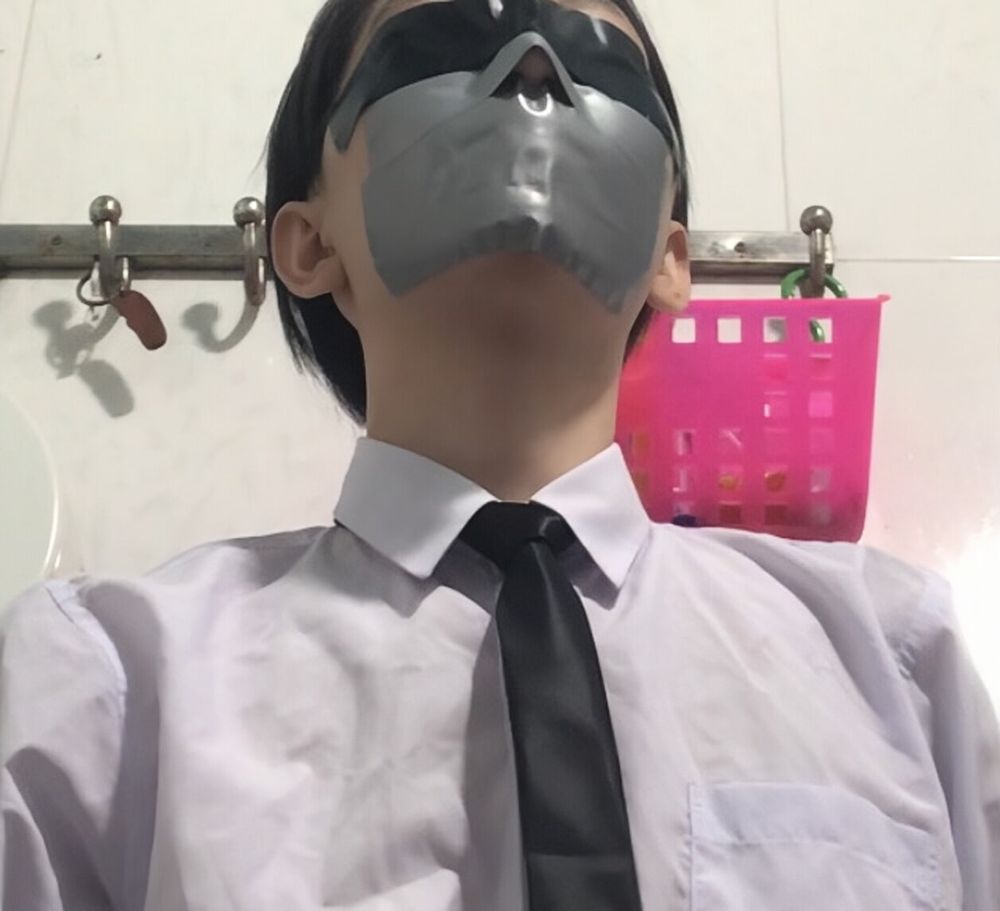 Wearing a white shirt and shiny black tie, gagged with duct  #2