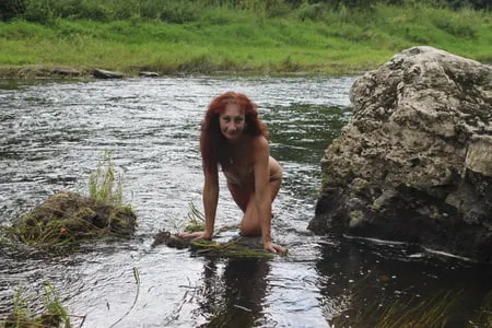 near a boulder in the river         