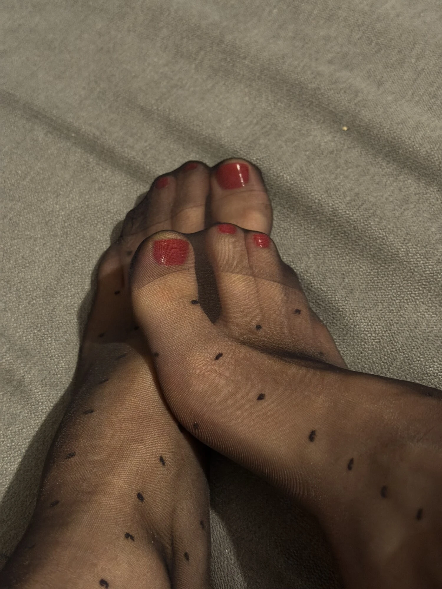Black Polka dot nylon socks with bright red nails