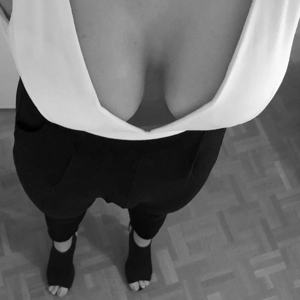 Black & white jumpsuit huge cleavage #2