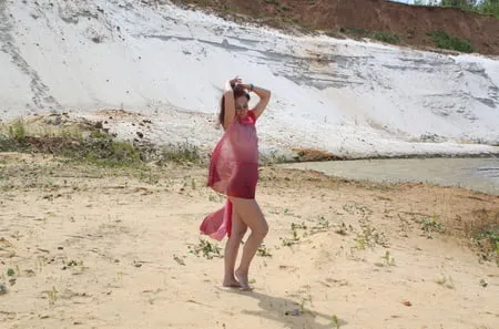 red shawl on white sand         