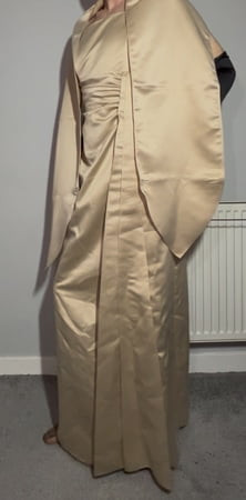 Sissy crossdresser wearing a satin gown 
