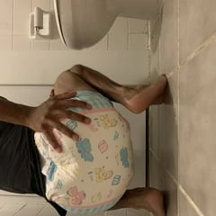 Black boy in wet diaper