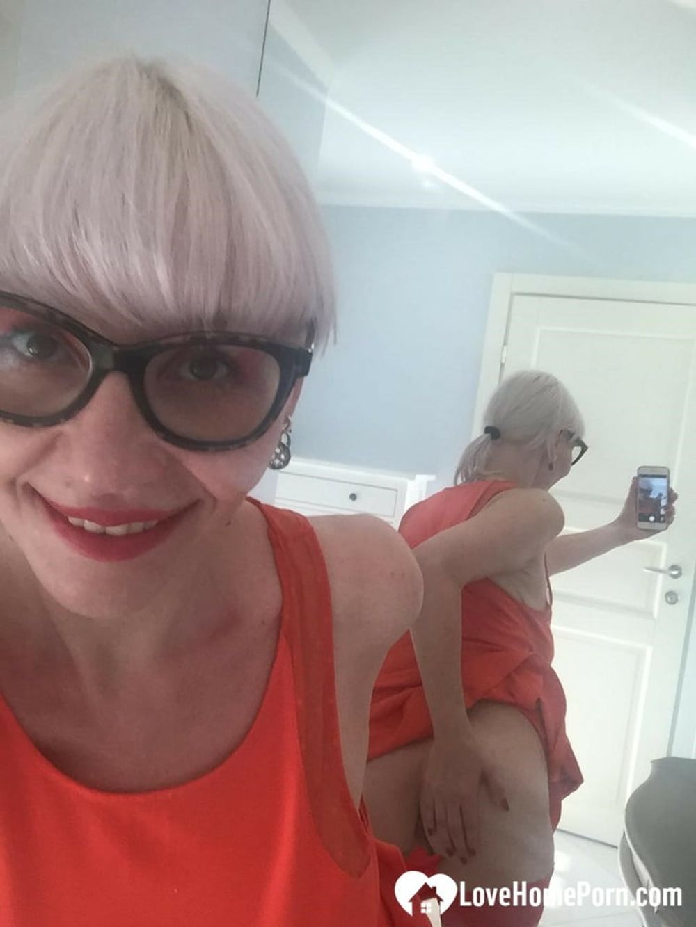 Blonde MILF with glasses teasing with nudes #8