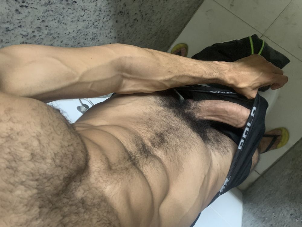 Huge 23cm dick of a very hard hairy male in the gym bathroom #11