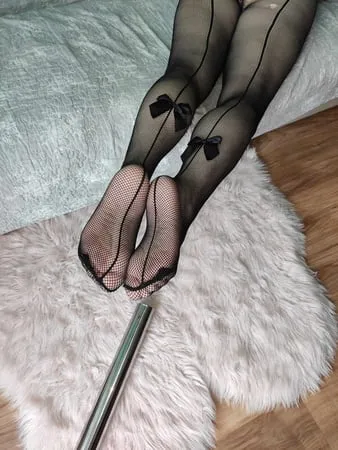 bare feet and fishnet feet heels         