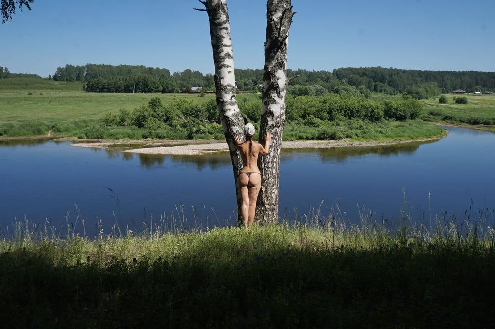 Nude near birch upon Volga