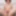 The playful sweetheart slips off her dress and works topless