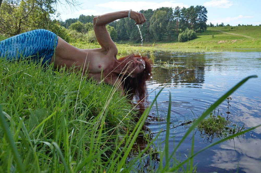 Mermaid plays with water #24