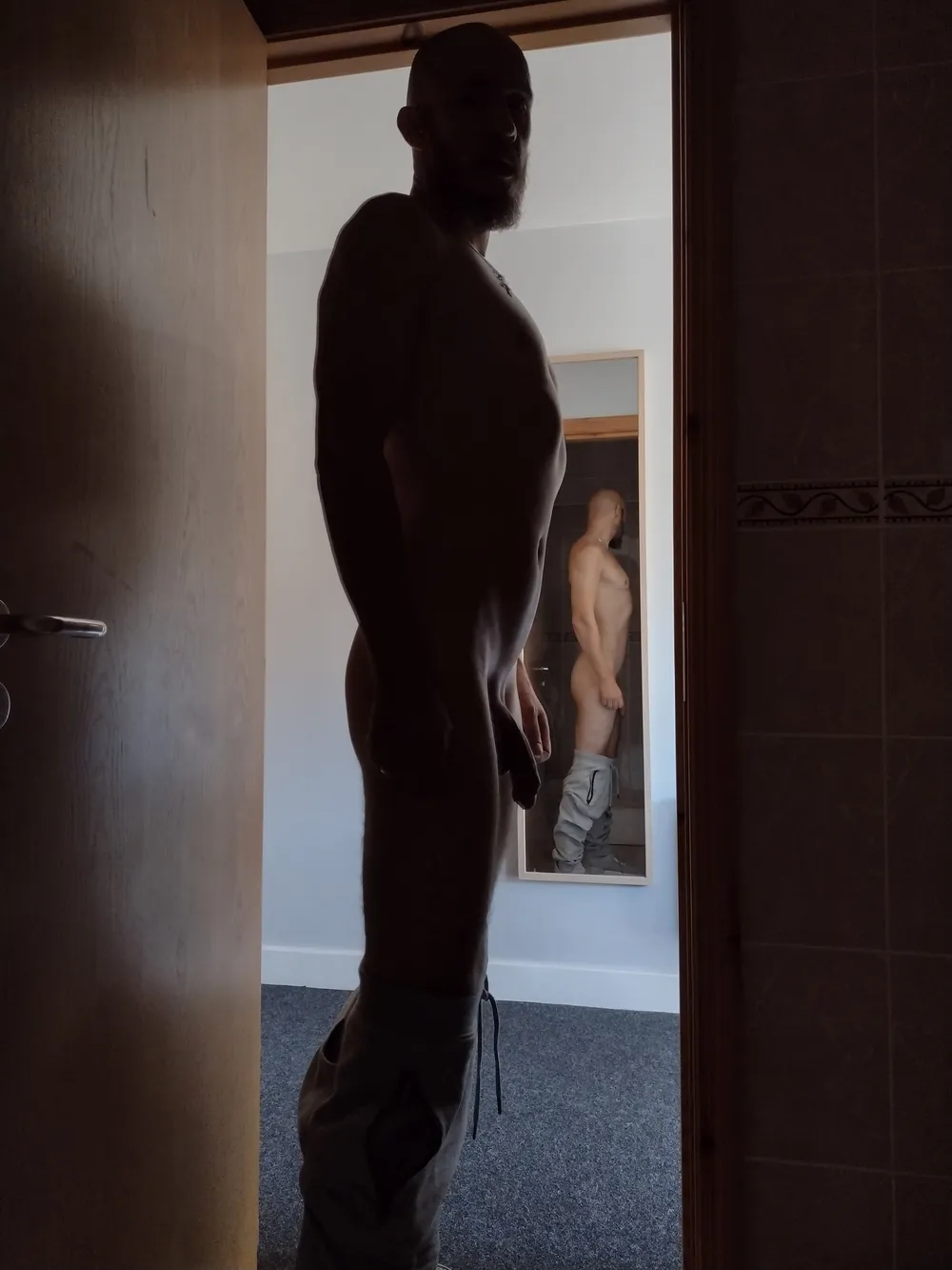 Posing nude in doorway #7