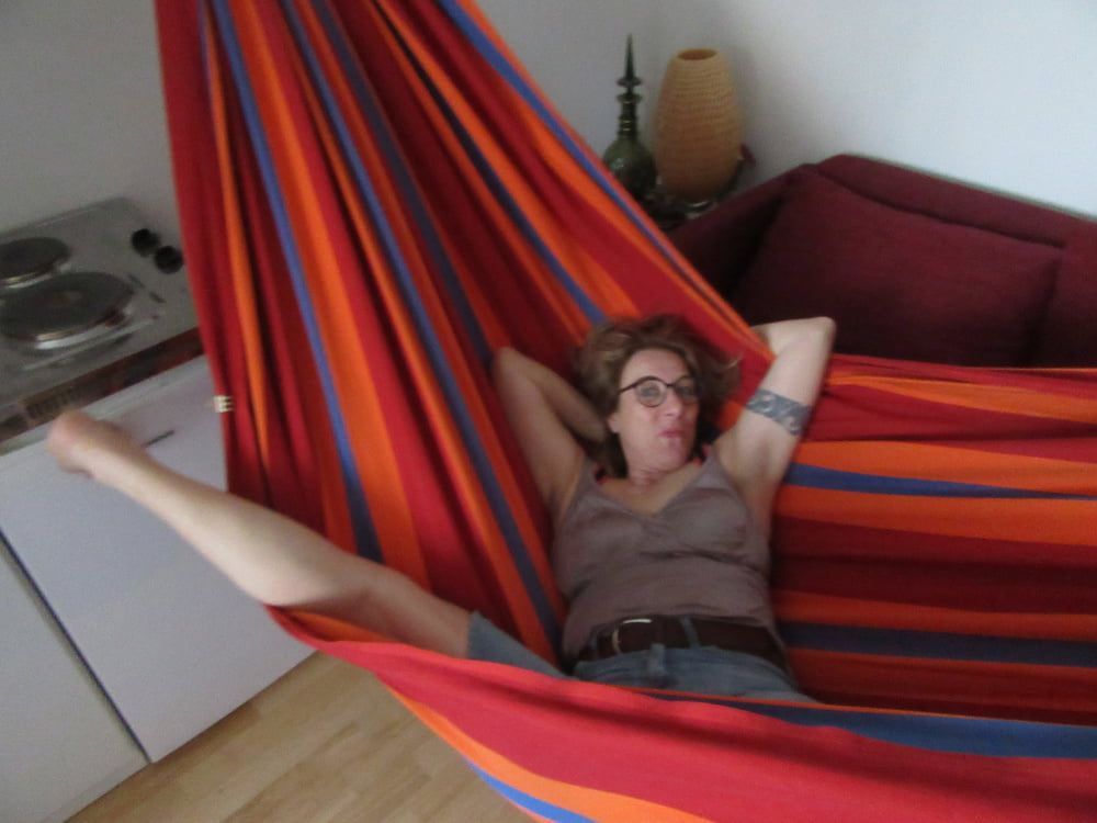 streching her legs in the hammock #4