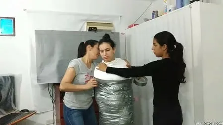 sexy girl trapped in ultra tight layered mummification         