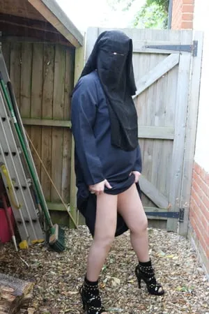 burqa outdoors flashing in the rain         