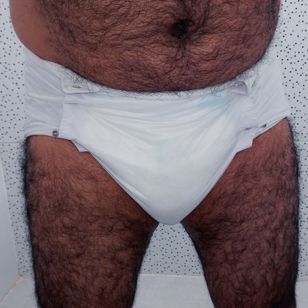 SHOWING WHITE DIAPER IN WORK BATHROOM. #2