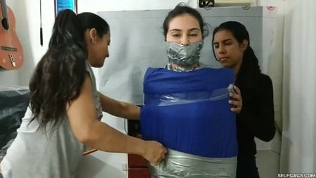 sexy girl trapped in ultra tight layered mummification         