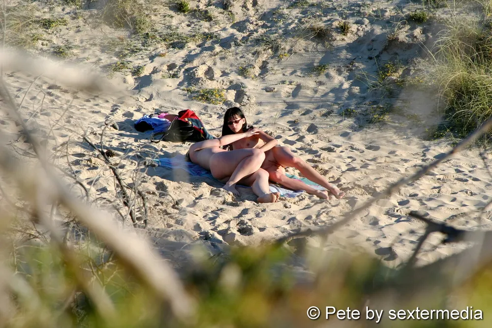 Naked lesbians have fun on the beach #7